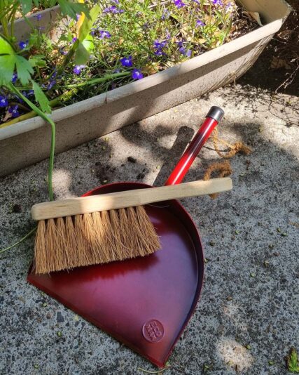 Ecomax Red Dust pan and dust brush outdoors on concrete floor