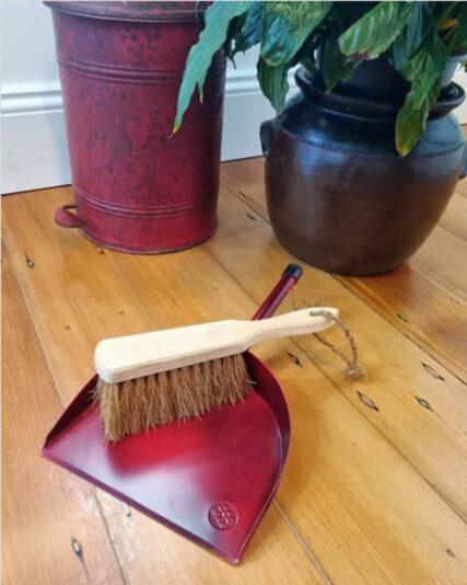 Ecomax Red Dust pan and dust brush indoors on timber floor